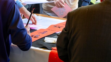 China, Spring Festival, calligrapher, handwritten Spring Festival couplets, brush characters,...