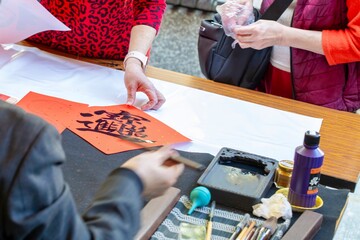 China, Spring Festival, calligrapher, handwritten Spring Festival couplets, brush characters,...