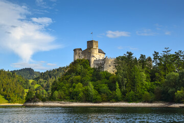 Fototapeta na wymiar Dunajec Castle in the village of Niedzica-Zamek, rising above Lake Czorsztyńskie, Poland.