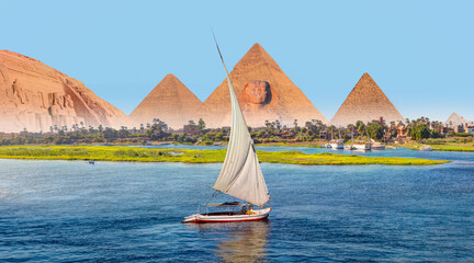 The Front of the Abu Simbel Temple, Aswan, Egypt, Africa - Beautiful Nile scenery with sailboat in...