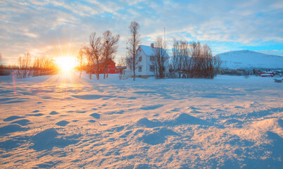 Beautiful winter landscape with white house and red cabin - Arctic city of Tromso, Norway
