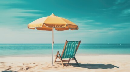 Beach vacation scene with deck chair and umbrella on sandy shore. Travel and relaxation.