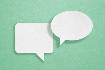 For conceptual image about communication and social media, customer feedback, Blank two white  grunge paper on rough green paper texture