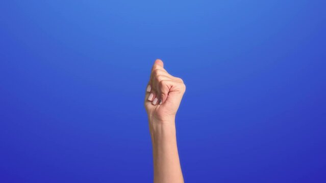The hand appears from below on a pink background, making a click of fingers, after which the background changes to blue, and the hand goes down