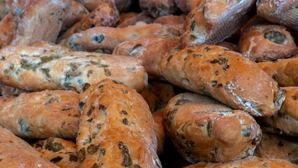 Freshly baked bread with raisins on sale at the Italian fine food market - 718799221