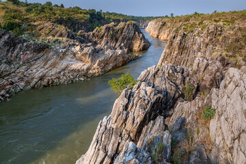 Fototapeta na wymiar Jabalpur, Madhya Pradesh/India : October 24, 2018 – Dhuandhar waterfall in Narmada river at Bhedaghat, Jabalpur.