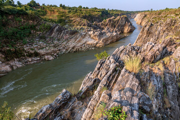 Fototapeta na wymiar Jabalpur, Madhya Pradesh/India : October 24, 2018 – Dhuandhar waterfall in Narmada river at Bhedaghat, Jabalpur.