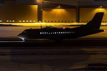 Passenger plane lands in winter night