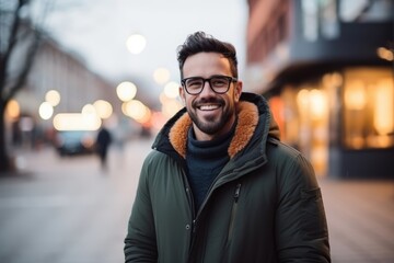 Fototapeta premium Portrait of a handsome young man in the city at night