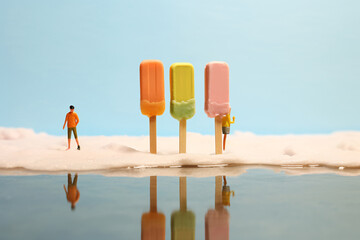Miniature People on Pastel Popsicle, Creative Summer Concept