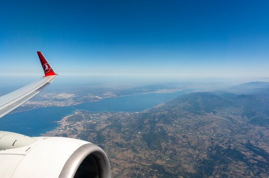 ISTANBUL, TURKEY, SEPTEMBER 13, 2017: THY airliner flying over Gebze And Yalova Regions, Marmara Sea and Osmangazi Bridge can be seen below.