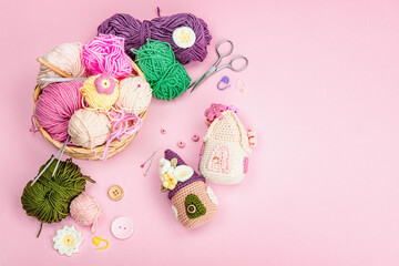 Handmade spring decor concept. Creative crocheting, house figurines, traditional flowers and stuff