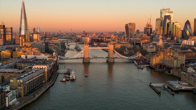 Aerial dawn to sunrise hyperlapse view of the Tower Bridge and skyline of London, England
