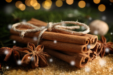 Different spices, closeup. Cinnamon, anise on brown sugar. Bokeh effect