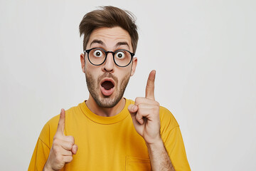 portrait of excited and shocked young man on isolated white background