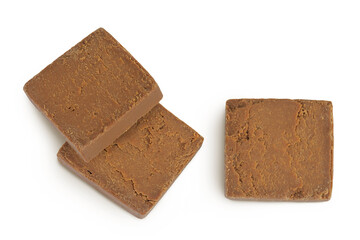 Brown cheese. Norwegian brunost isolated on white background. Top view. Flat lay