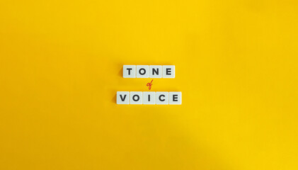 Tone of Voice Phrase in Branding and Communication. Text on Block Letter Tiles on Yellow Orange...