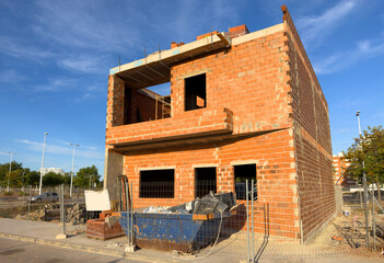 House building in Spain. Villa construction. Bricks house under construction. Construction of modern house. Home renovation and reconstruction. Home building at coastline. Build a house from brick.