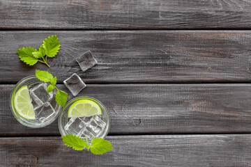Two glasses of refreshing cocktail mojito with mint and ice, top view