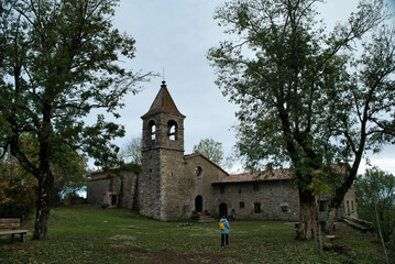 Girl hiking in the Sanctuary located on a plain above the Sierra de Cabrera, at 1,294 meters above sea level, Sanctuary of the Virgen de Cabrera. Osona, Catalonia Spain