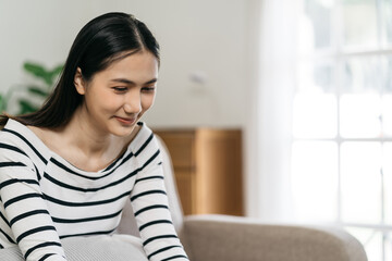 Woman using smartphone and laptop. Home office. Work place. Lifestyle.