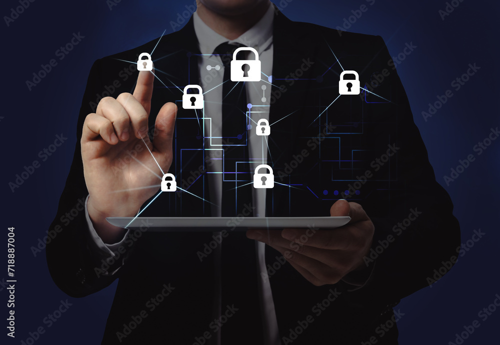 Poster privacy protection. man using tablet and touching icon of padlock on dark blue background, closeup. 