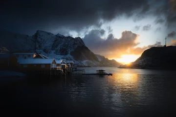 Foto auf Acrylglas Reinefjorden Night winter photography of the fishing village Reine with snowy mountains in the background in the Lofoten Islands, Norway.