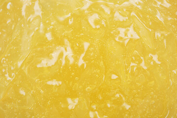 Texture of yellow jelly or gelatin product cream or emulsion