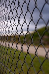 Fototapeta premium Barbed wire fence on the sunset black and white photography