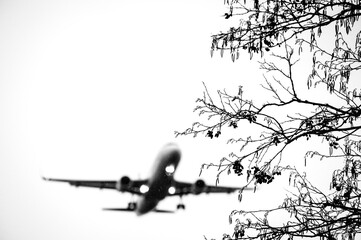 Silhouette of airplane in the sky close-up