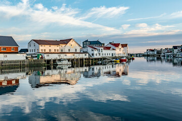 scenic reflection of typical wooden houses in the harbor of Svolvaer,Norway - obrazy, fototapety, plakaty