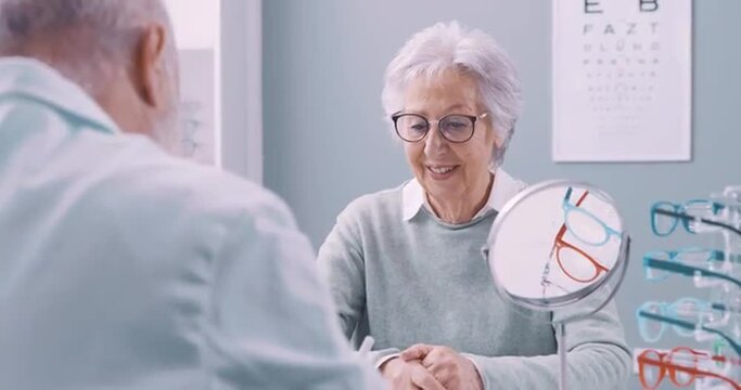 Senior woman and eye care professional