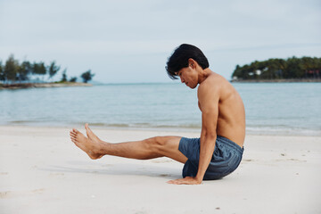 Active Asian Athlete Running on the Beach at Sunset, Exuding Strength and Freedom