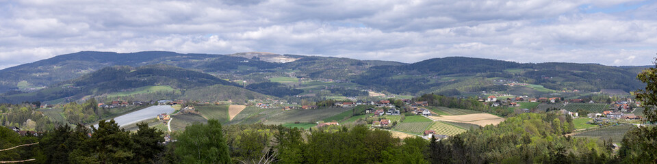 banner 4?1 View of low wooded hills and villages in the valley. Austria.