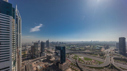 Sunrise over media city and al barsha heights district area night to day timelapse from Dubai marina.