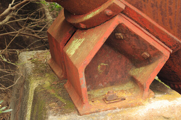 Metal bracket on concrete plinth
