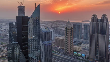 Foto op Canvas High-rise buildings on Sheikh Zayed Road in Dubai aerial timelapse during sunset, UAE. © neiezhmakov