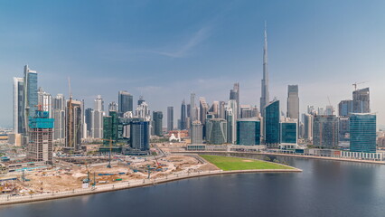 Fototapeta premium Aerial view to Dubai Business Bay and Downtown with the various skyscrapers and towers timelapse