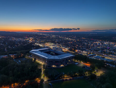 Fototapeta Aerial panoramic skyline cityscape of Kaiserslautern city and and stadium at night (blue hour). Rhineland-palatinate, Germany