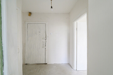 rough repairs for self-finishing. interior decoration, bare walls of the room, stage of construction. interior apartment room