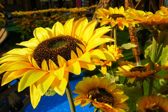 Close-up of artificial sunflower in the outdoors with sunlight. Artificial sunflower for decoration.