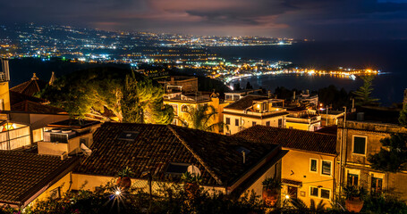 Beautiful view of night town of Italy with colorful golden lights, night landscape on city of Europe