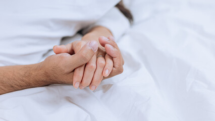 Happy love Asian young man and woman staying together in bedroom, Valentine's Day, Concept of holiday and surprise.
