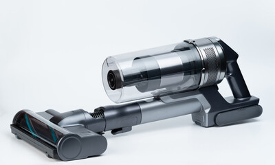 Mini grey vacuum cleaner with brush