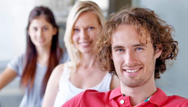 Portrait, smile and creative collaboration with people in office for design, team building or project management. Face, small business or startup with man and woman designer group in workplace