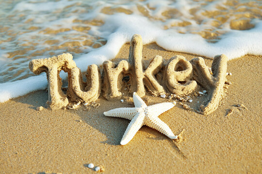 Photo of Turkey name made out of sand on the beach