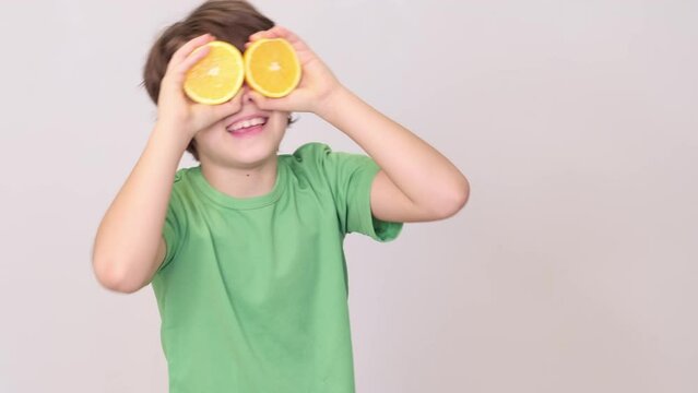 Slices of orange transform into a whimsical mask on a young face, invoking the joy found in nature s gifts. Vibrant oranges become playful goggles, emphasizing the fun side of vitamin-rich foods.