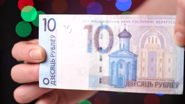 close-up Belarusian 10 ten ruble bill in female hands