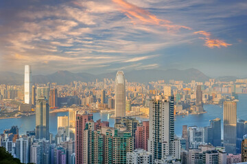 Wonderful panoramic of Hong Kong city view from Victoria Peak, modern cityscape during sunset in the evening with amazing clouds.