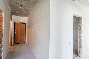 rough repairs for self-finishing. interior decoration, bare walls of the room, stage of construction. interior apartment room